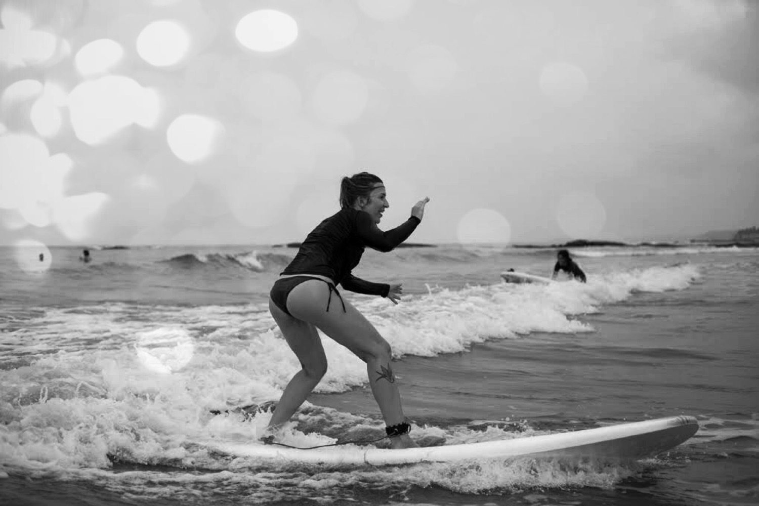 Lola surfing on a wave