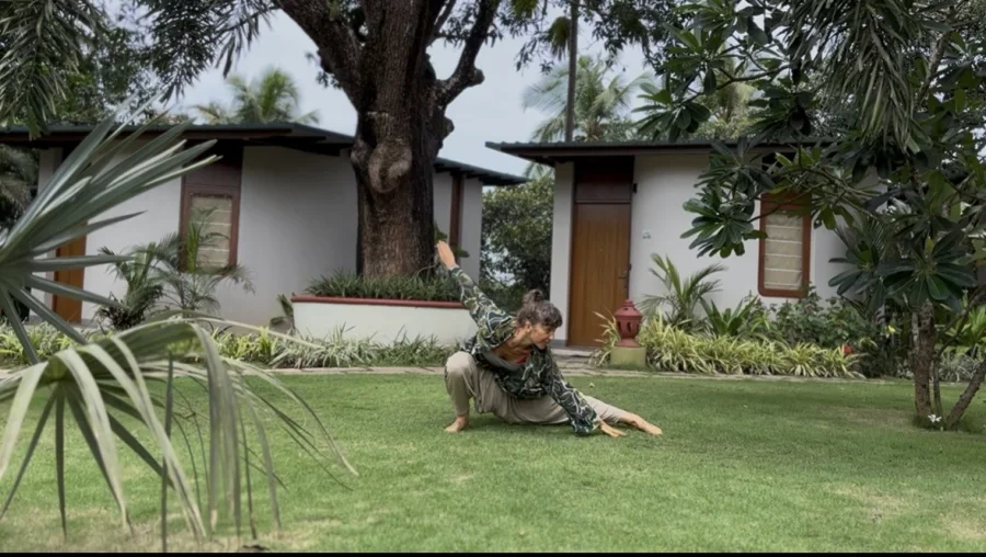 Lola integrating Dragon Wings movement into everyday life on a quiet lawn